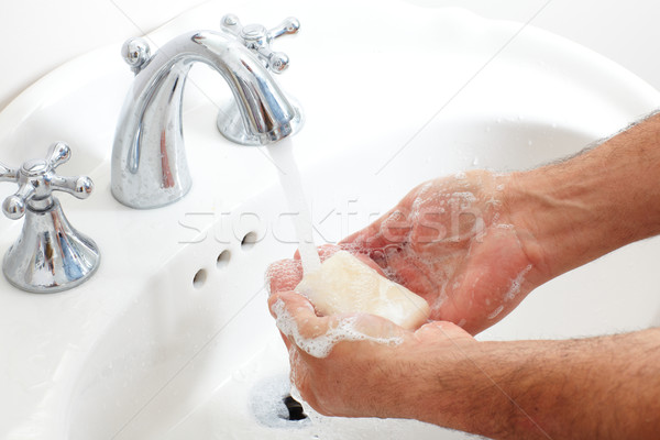 Man washing hands with soap and water. Stock photo © Kurhan