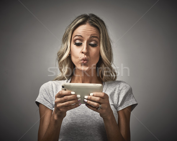 Stock photo: Girl with smartphone.