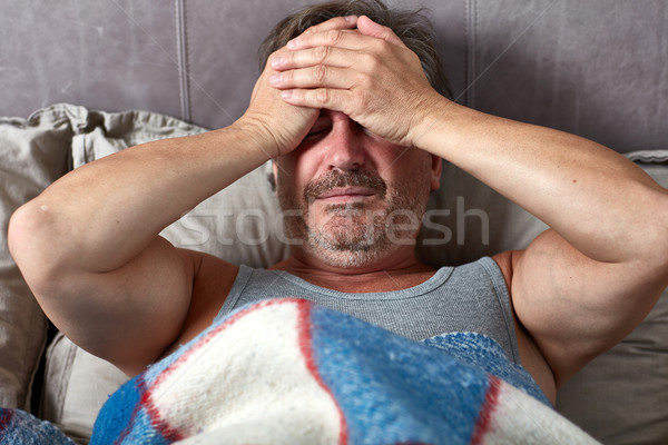 Sick man in bed Stock photo © Kurhan