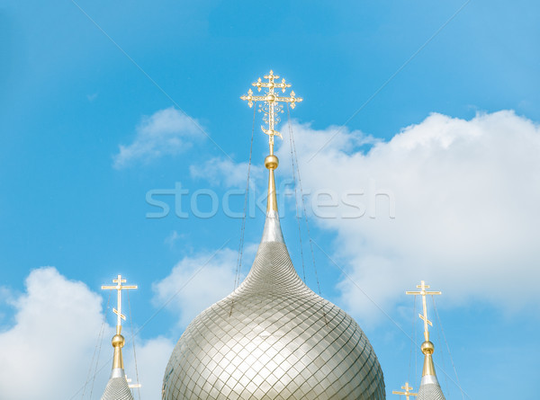 Domes of russian church against blue sky. Stock photo © kyolshin