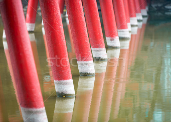 Detail of wooden red bridge with water background. Stock photo © kyolshin