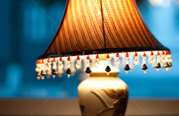Classic lamp with dim light near window. Stock photo © kyolshin