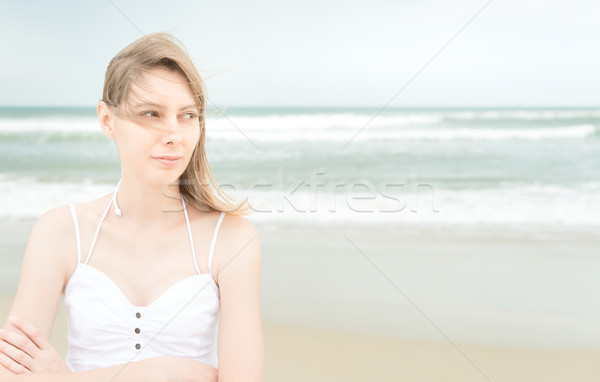 Pretty woman on beach looking somewhere. Stock photo © kyolshin