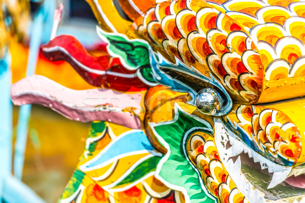 Multicolored face of vietnamese dragon. Stock photo © kyolshin