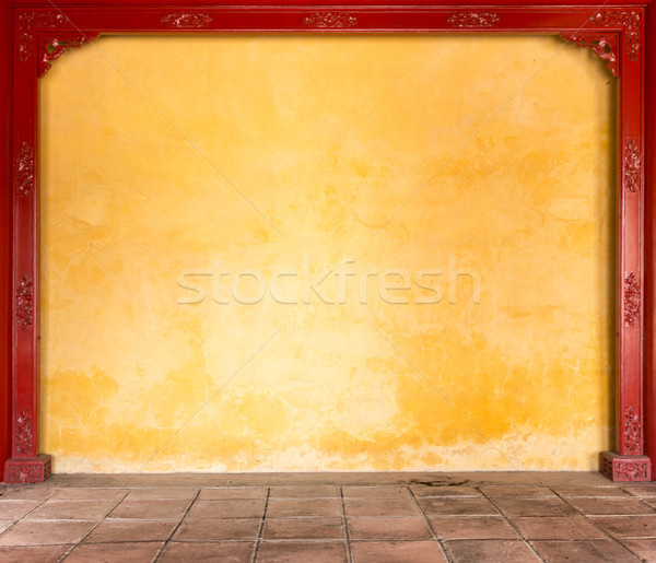 Yellow stucco wall with pattern in frame. Stock photo © kyolshin