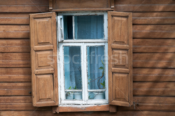 Window of old wooden house. Stock photo © kyolshin