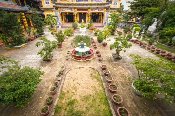 Buddhist temple and its green yard in Hoi An. Stock photo © kyolshin