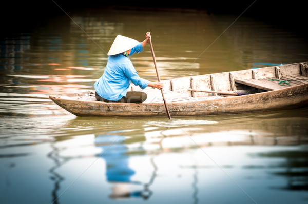 Woman on wooden boat in river in Vietnam, Asia. Stock photo © kyolshin