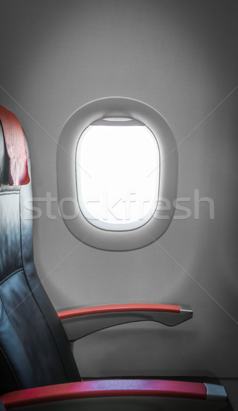 Passenger seat in plane with window aside. Stock photo © kyolshin