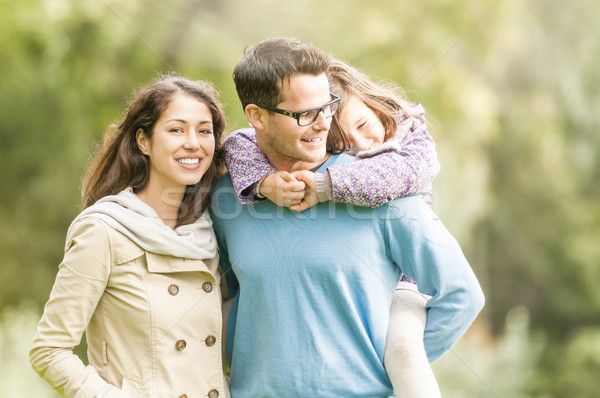 Happy family of three having fun outdoor. Stock photo © kyolshin