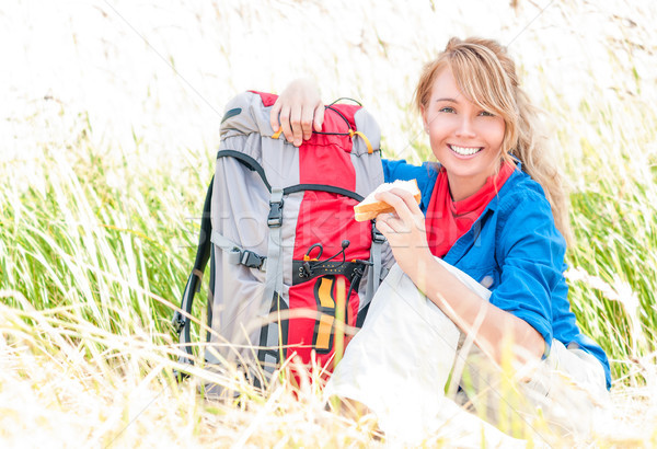 Young tourist woman having lunch outdoors. Stock photo © kyolshin