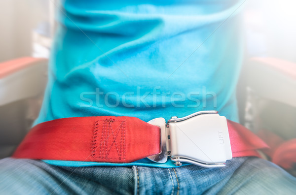 Férfi visel piros ülés öv biztonság Stock fotó © kyolshin