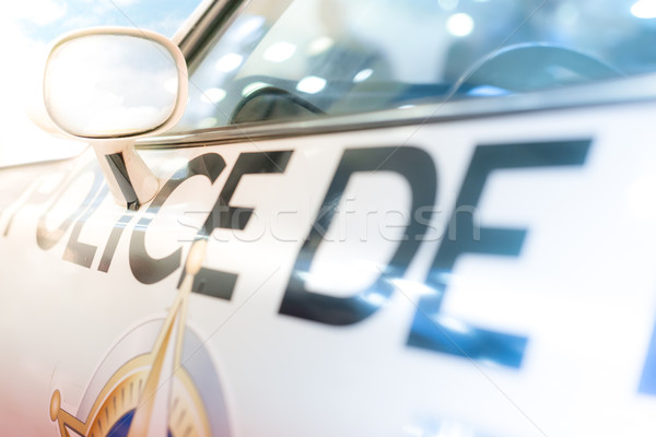 Door, window and side mirror of police car. Stock photo © kyolshin