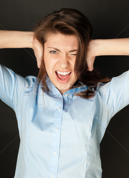 Młoda kobieta krzyczeć piękna niebieski shirt ciemne włosy Zdjęcia stock © kyolshin