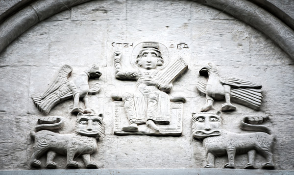 Arched wall in church with five carved characters. Stock photo © kyolshin