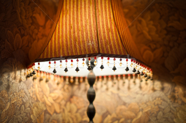 Classic lamp with dim light near wall. Stock photo © kyolshin