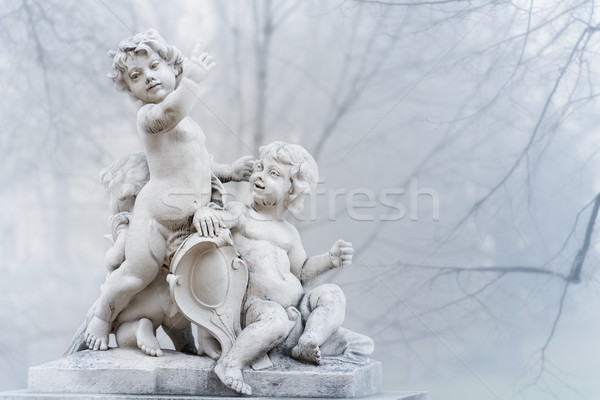 Statue of small boys in park. Vienna, Austria. Stock photo © kyolshin