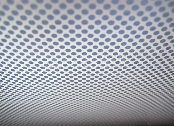 Grey background of perforated metal texture. Stock photo © kyolshin