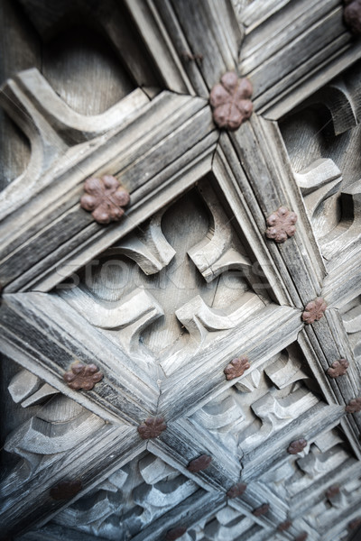 Old wooden door with floral ornament. Stock photo © kyolshin