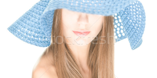 Young woman with half hidden face under blue hat. Stock photo © kyolshin