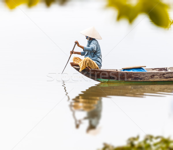 Woman on wooden boat in river in Vietnam, Asia. Stock photo © kyolshin