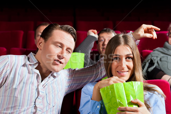 Stock photo: Couple in cinema with popcorn