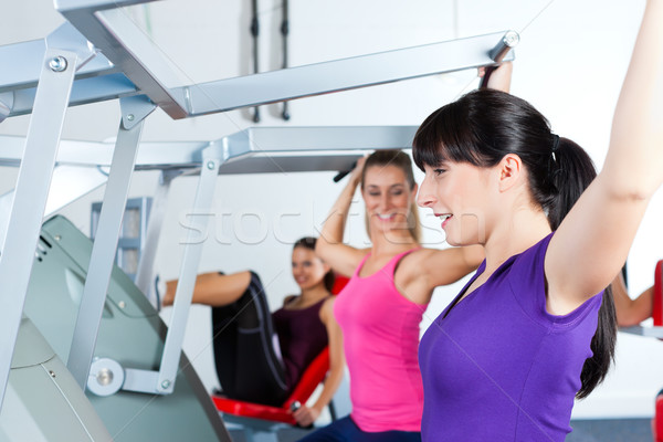 gym people doing strength or fitness training Stock photo © Kzenon