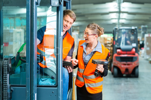 Forklift driver and supervisor at warehouse Stock photo © Kzenon