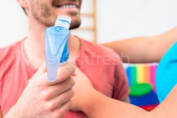 Man taking pulmonary function test with mouthpiece in his hand Stock photo © Kzenon