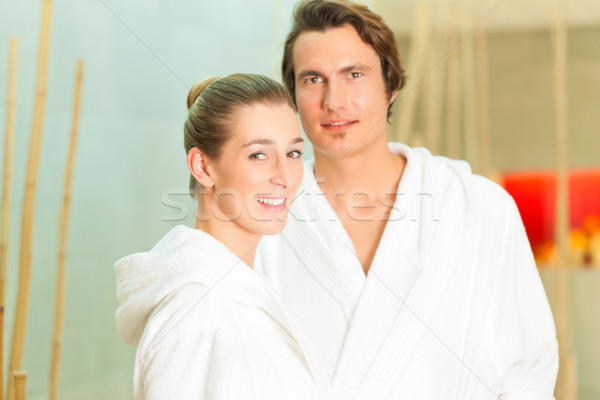 Young couple in bathrobe in Spa Stock photo © Kzenon