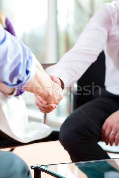 Man shaking hands with manager at job interview closeup cutout Stock photo © Kzenon