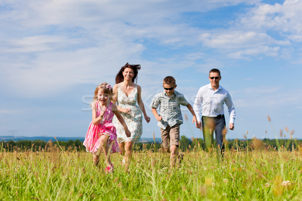 ストックフォト: 幸せな家族 · 草原 · 夏 · 母親 · 父 · 子供