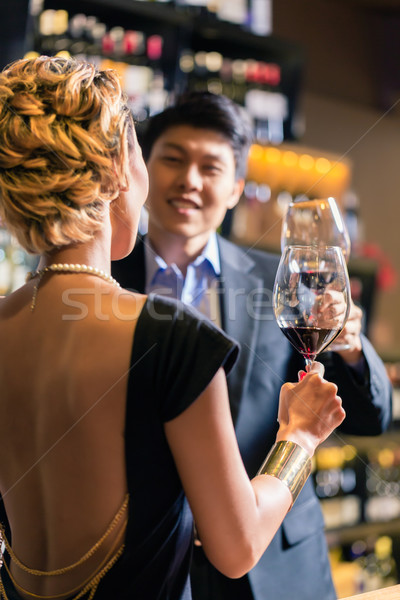 ázsiai pár iszik vörösbor pirít bor Stock fotó © Kzenon