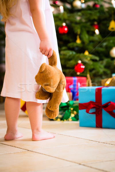 Girl with present and teddy on Christmas day Stock photo © Kzenon