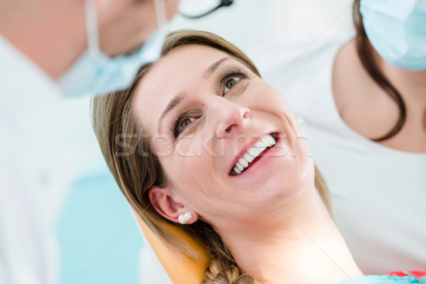 Woman with healthy smile at dentist  Stock photo © Kzenon