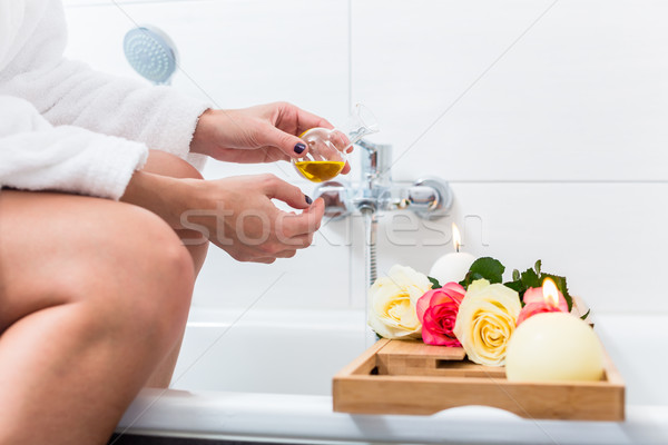 Woman preparing wellness bath in tub. Stock photo © Kzenon