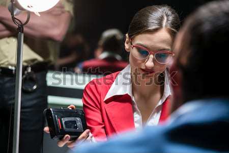 Stock photo: Police detective recording the statement of a suspect during the