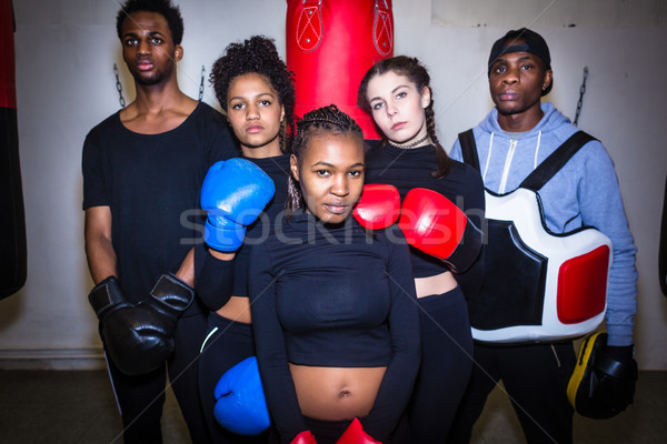 Portrait of four young determined boxers and their experienced b Stock photo © Kzenon