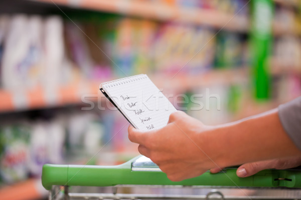 Woman Shopping with Checklist and Trolley Stock photo © Kzenon