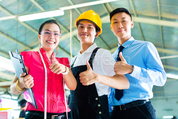 Worker, manager and designer in Chinese factory Stock photo © Kzenon