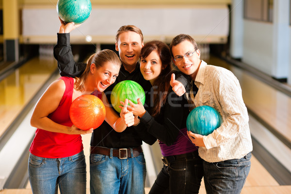 Friends bowling together Stock photo © Kzenon