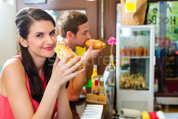 Customers eating Hotdog in fast food snack bar Stock photo © Kzenon