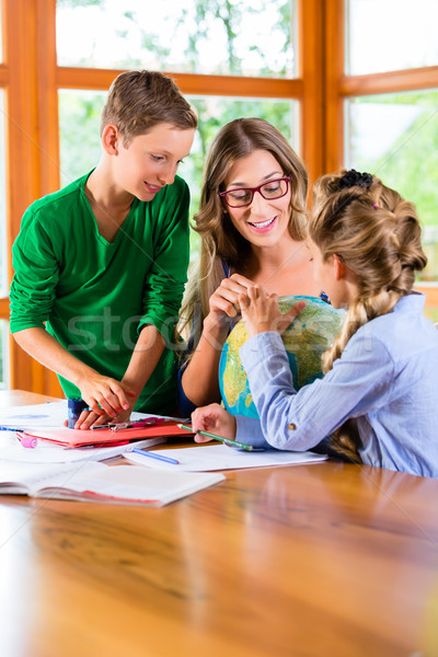 Mother teaching kids private lessons for school Stock photo © Kzenon