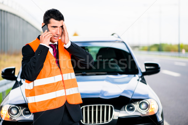Man with car breakdown calling towing company Stock photo © Kzenon