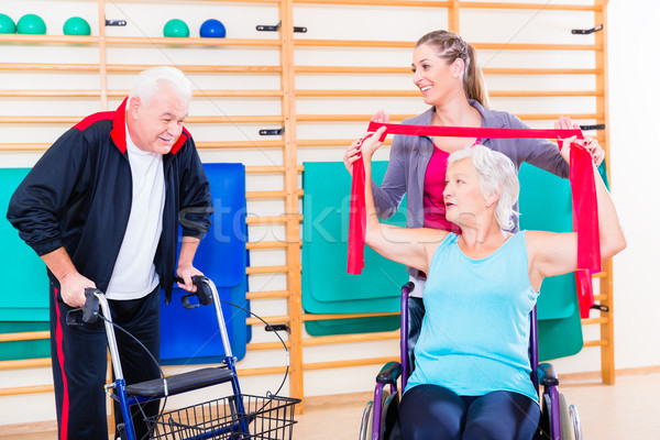 Seniors in physical rehabilitation therapy Stock photo © Kzenon