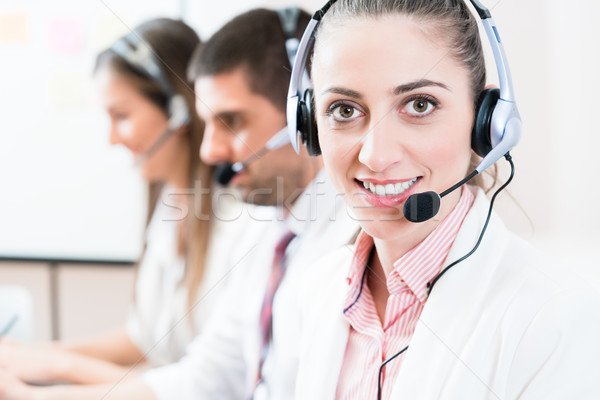 Woman and men working as call center agents Stock photo © Kzenon