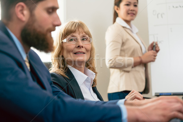 Stock photo: Portrait of a middle-aged woman during business meeting