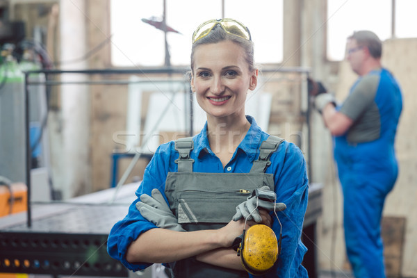 Stock photo: Workers in a metal workshop 