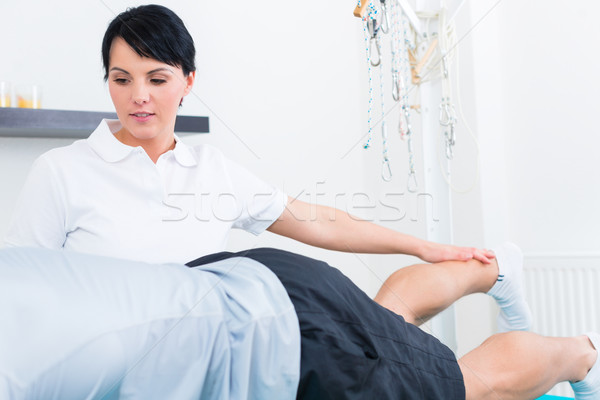 Physiotherapist with patient in practice  Stock photo © Kzenon