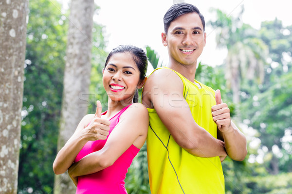 Asian woman and man during jogging training Stock photo © Kzenon